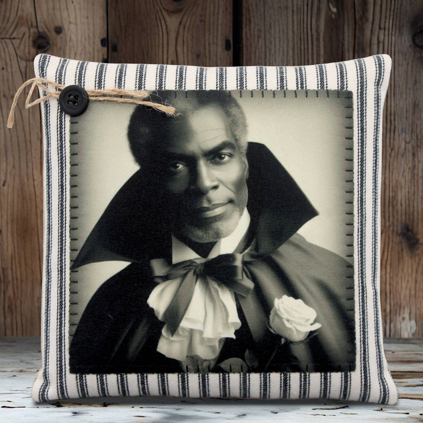 Decorative pillow with a black and white portrait of a handsome vampire in a cape and bow tie