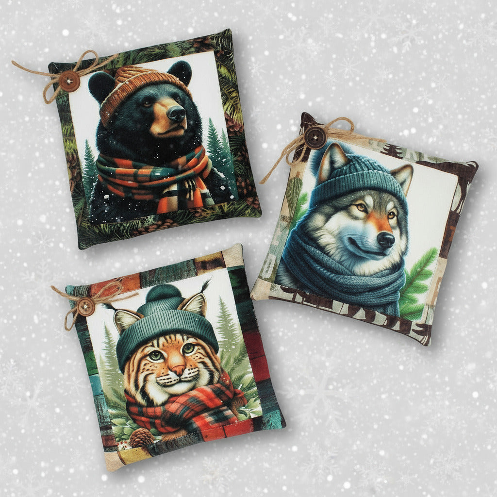 Set of three mini pillow tucks or bowl fillers with a black bear, wolf and bobcat dressed in winter hats and scarves