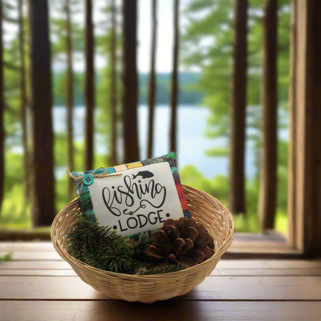 Decorative basket with a sign reading 'Fishing Lodge'