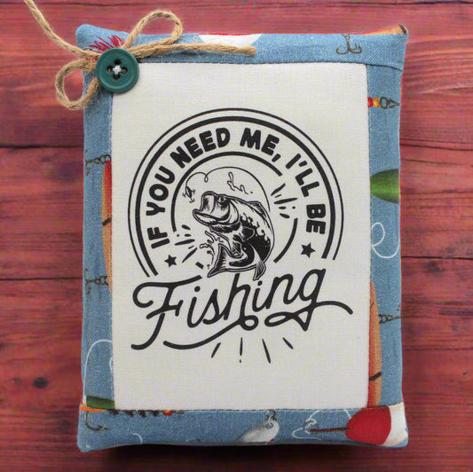 Small fabric mini pillow bowl filler with fishing-themed design and text on a white background