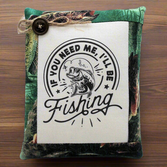 Pillow tuck bowl filler with fishing-themed text and graphic on a wooden surface