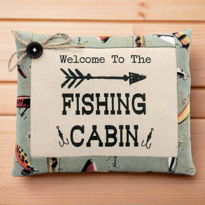 Decorative pillow tuck bowl filler with 'Welcome to the Fishing Cabin' text on a wooden background
