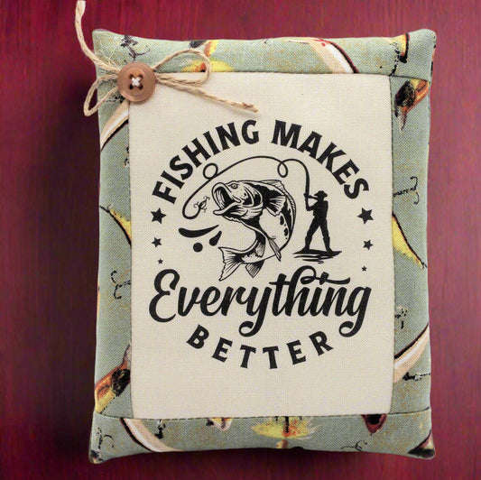 Small pillow bowl filler with fishing-themed text and graphics on a red background