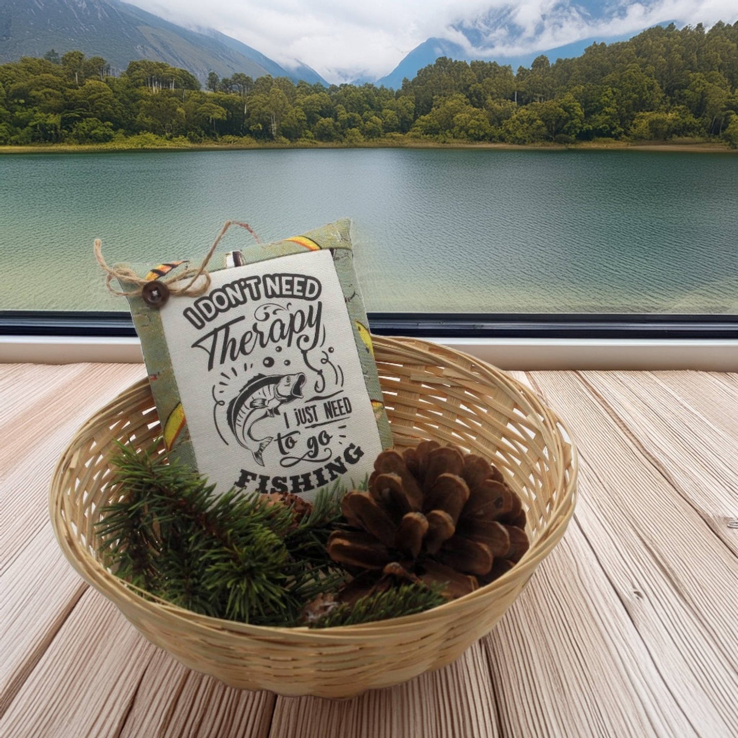 Basket with a sign and fishing lure by a lake