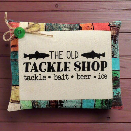 Mini pillow tuck with 'The Old Tackle Shop' text and fish illustrations on a wooden background