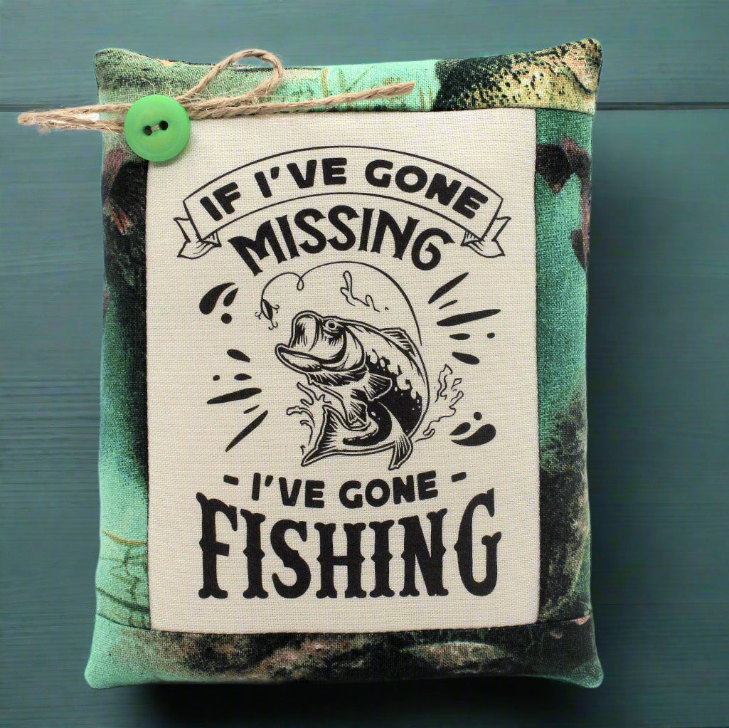 Mini pillow bowl filler with fishing-themed text and graphic on a camouflage background
