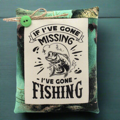 Mini pillow bowl filler with fishing-themed text and graphic on a camouflage background