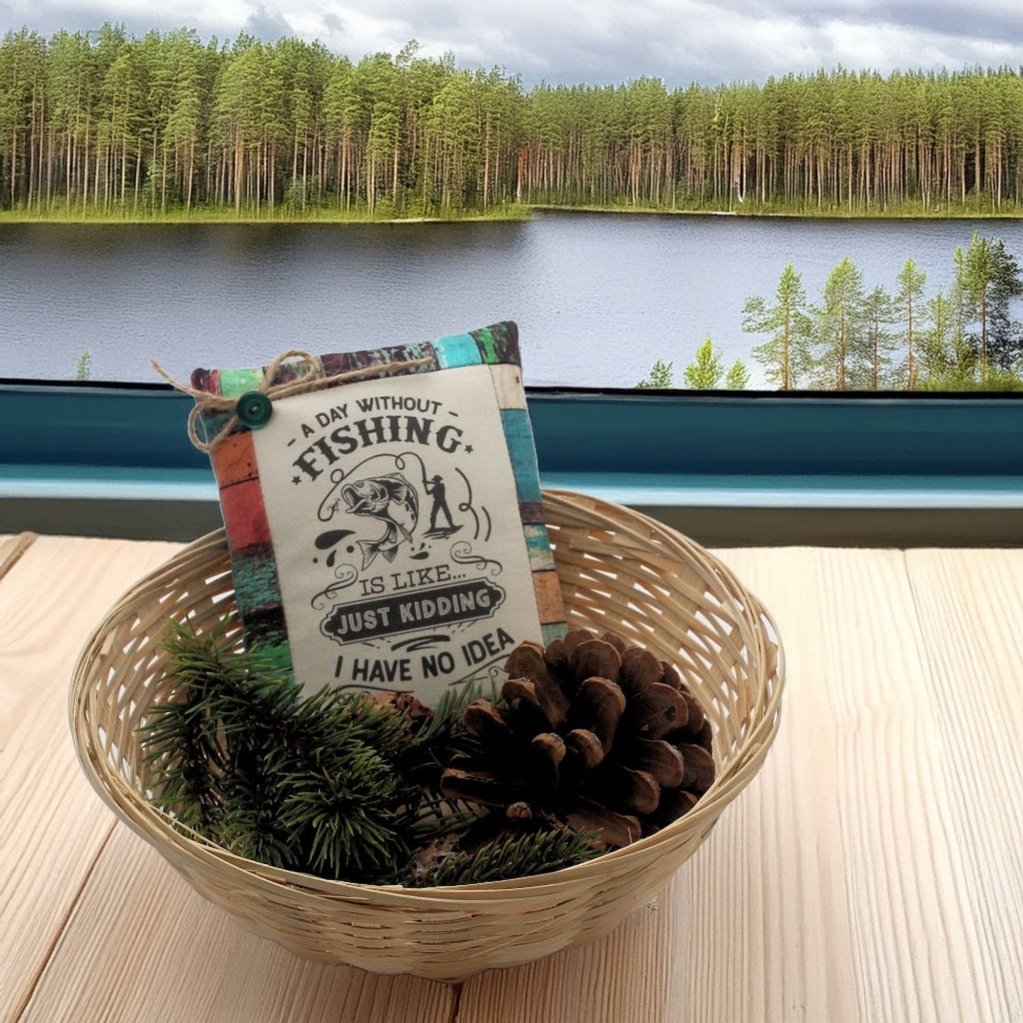 Basket with decorative items and a sign about fishing by a lake