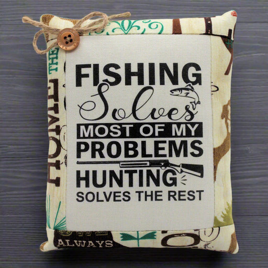 Decorative pillow tuck with fishing and hunting quote on a camouflage background