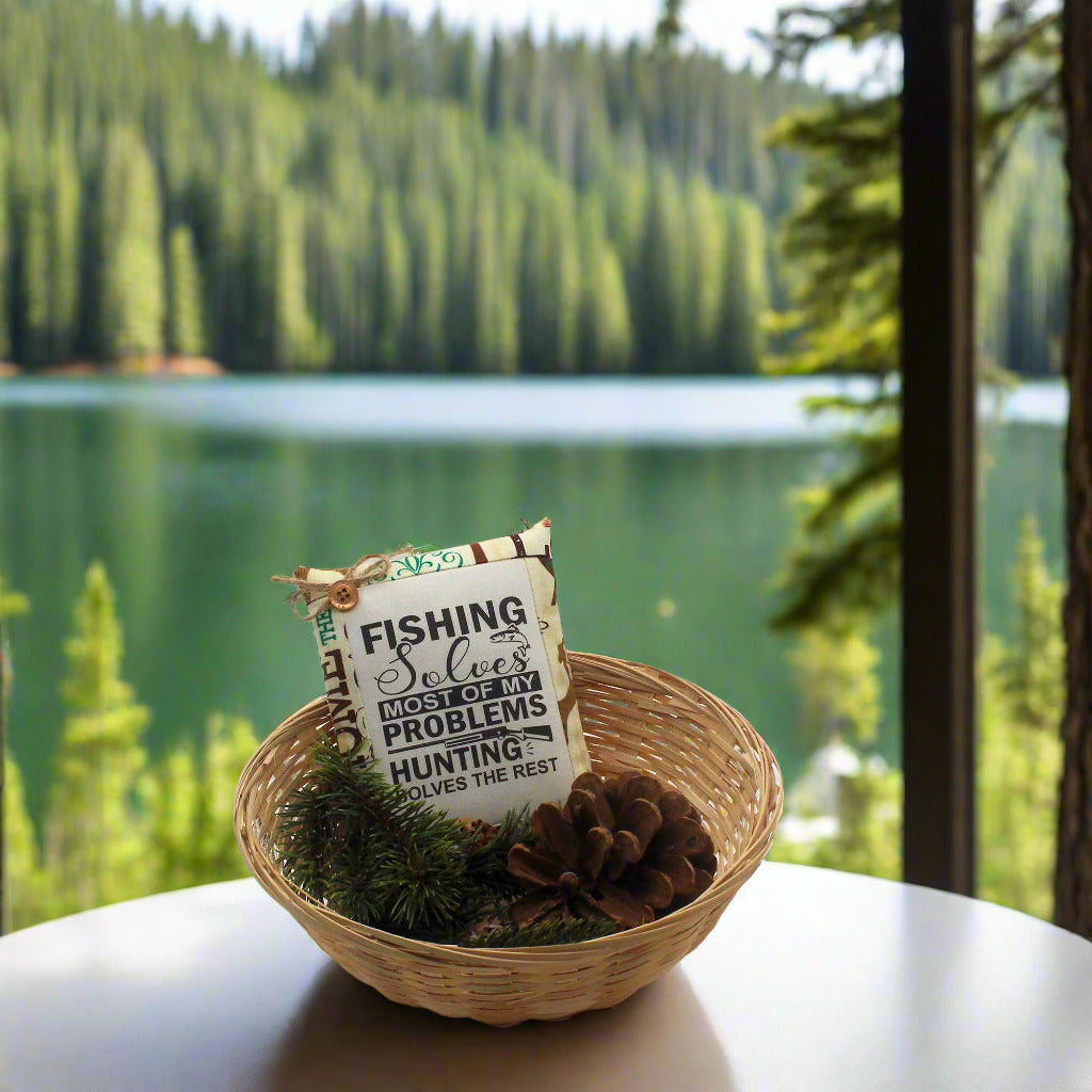 Decorative sign in a woven basket with a scenic lake and forest background