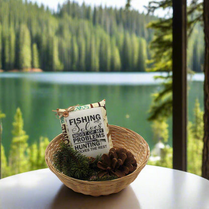 Decorative sign in a woven basket with a scenic lake and forest background