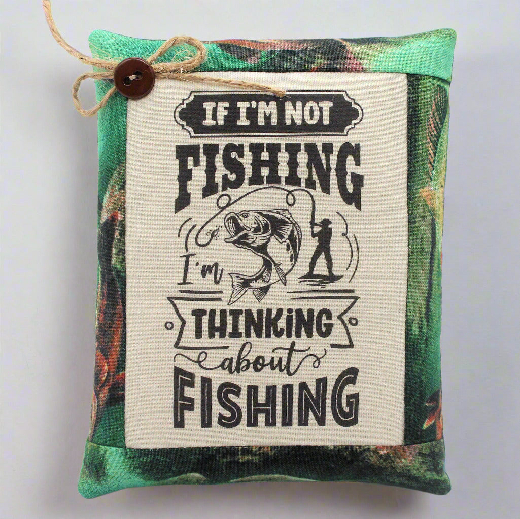 Mini pillow bowl filler with fishing-themed text and graphics on a camouflage background