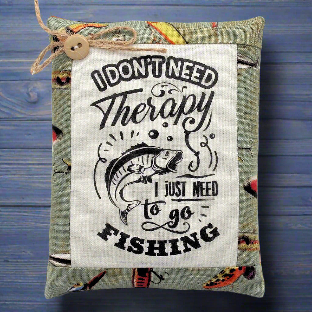 Decorative pillow tuck bowl filler with fishing-themed text and graphics on a wooden background