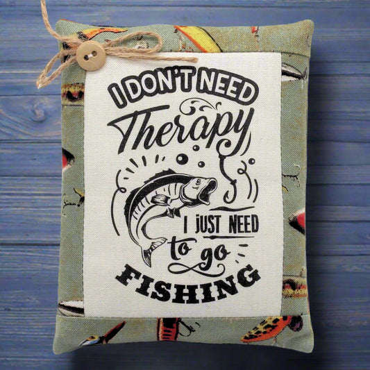 Decorative pillow tuck bowl filler with fishing-themed text and graphics on a wooden background