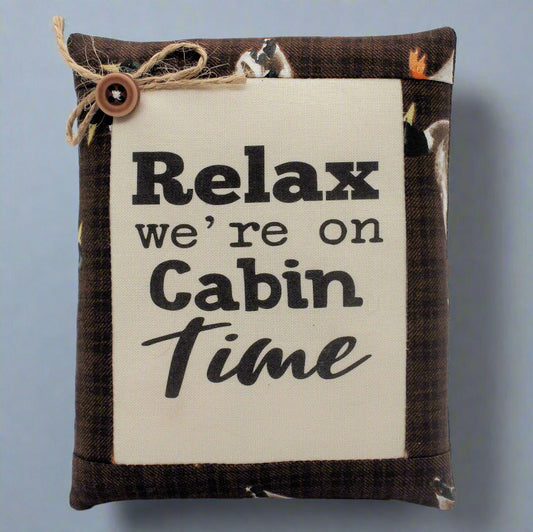 Decorative pillow tuck bowl filler with 'Relax we're on Cabin Time' text on a plain background