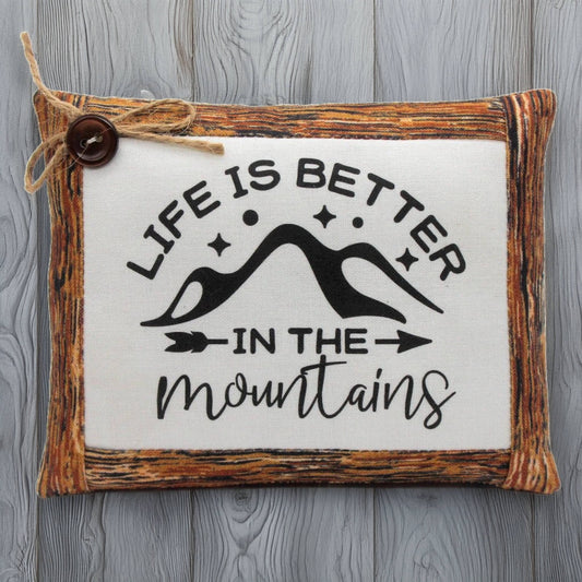 Decorative pillow bowl filler with 'Life is better in the mountains' text on a wooden frame.