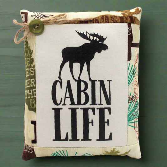 Pillow bowl filler with moose design and 'Cabin Life' text on a green background