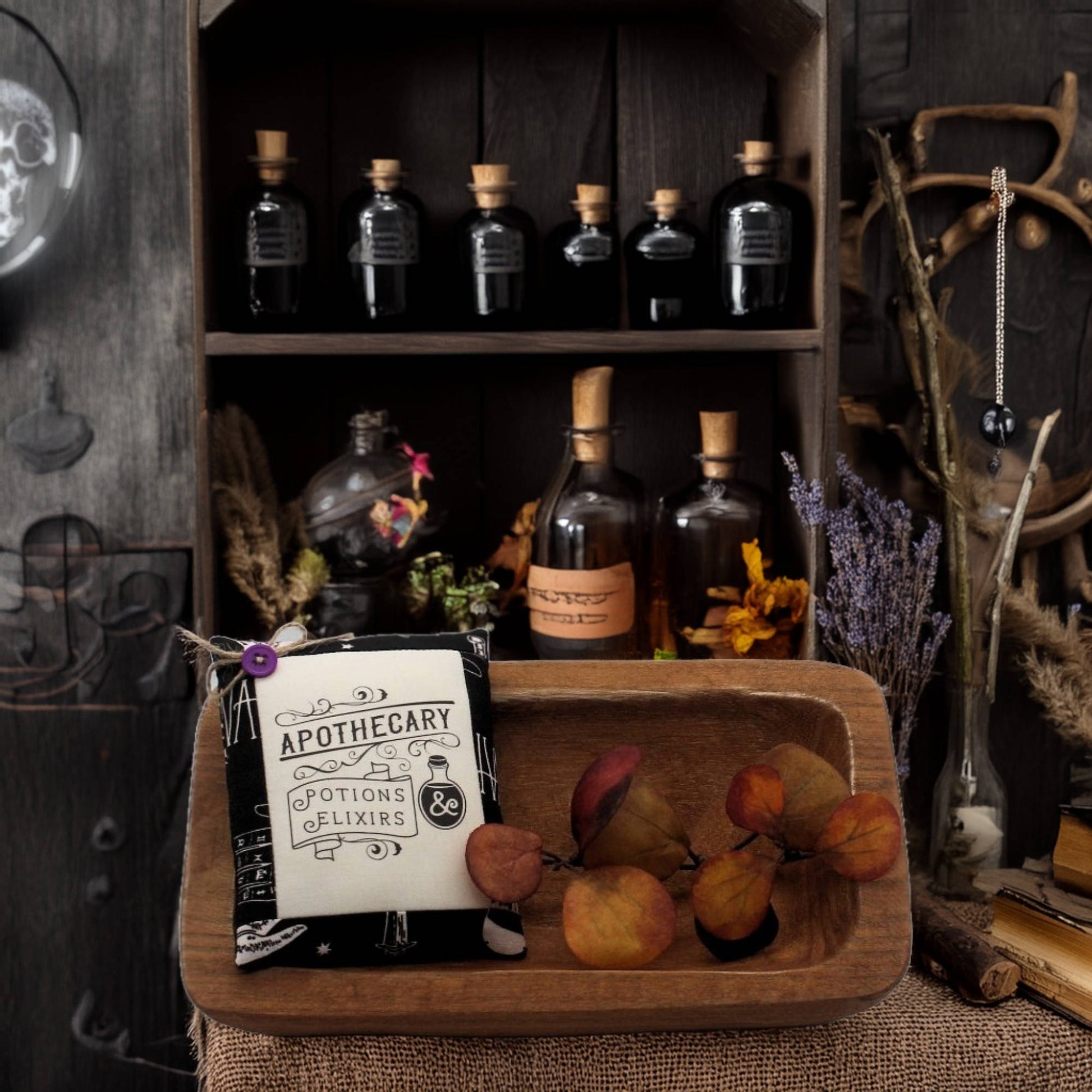 Wooden shelf with apothecary bottles and a sign, surrounded by decorative elements.