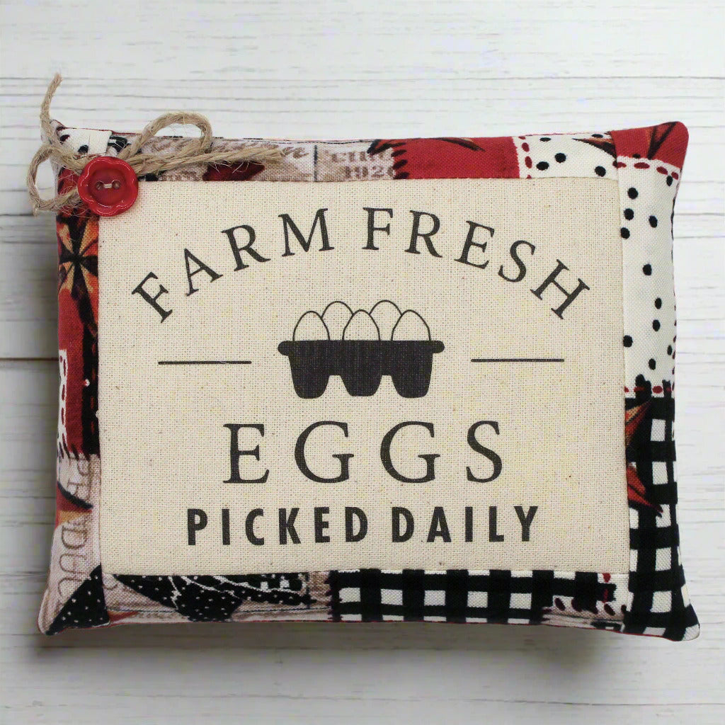 Decorative mini pillow bowl filler sign with 'Farm Fresh Eggs Picked Daily' text and egg carton graphic on a white background.