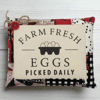 Decorative mini pillow bowl filler sign with 'Farm Fresh Eggs Picked Daily' text and egg carton graphic on a white background.
