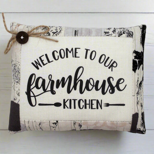 Pillow tuck with 'Welcome to our Farmhouse Kitchen' text on a white background