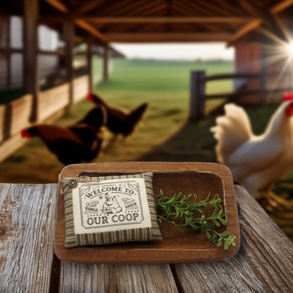 Wooden tray with a 'Welcome to Our Coop' sign and a rooster in the background.
