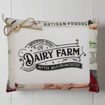 Mini pillow bowl filler sign with 'Dairy Farm' branding on a white wooden background