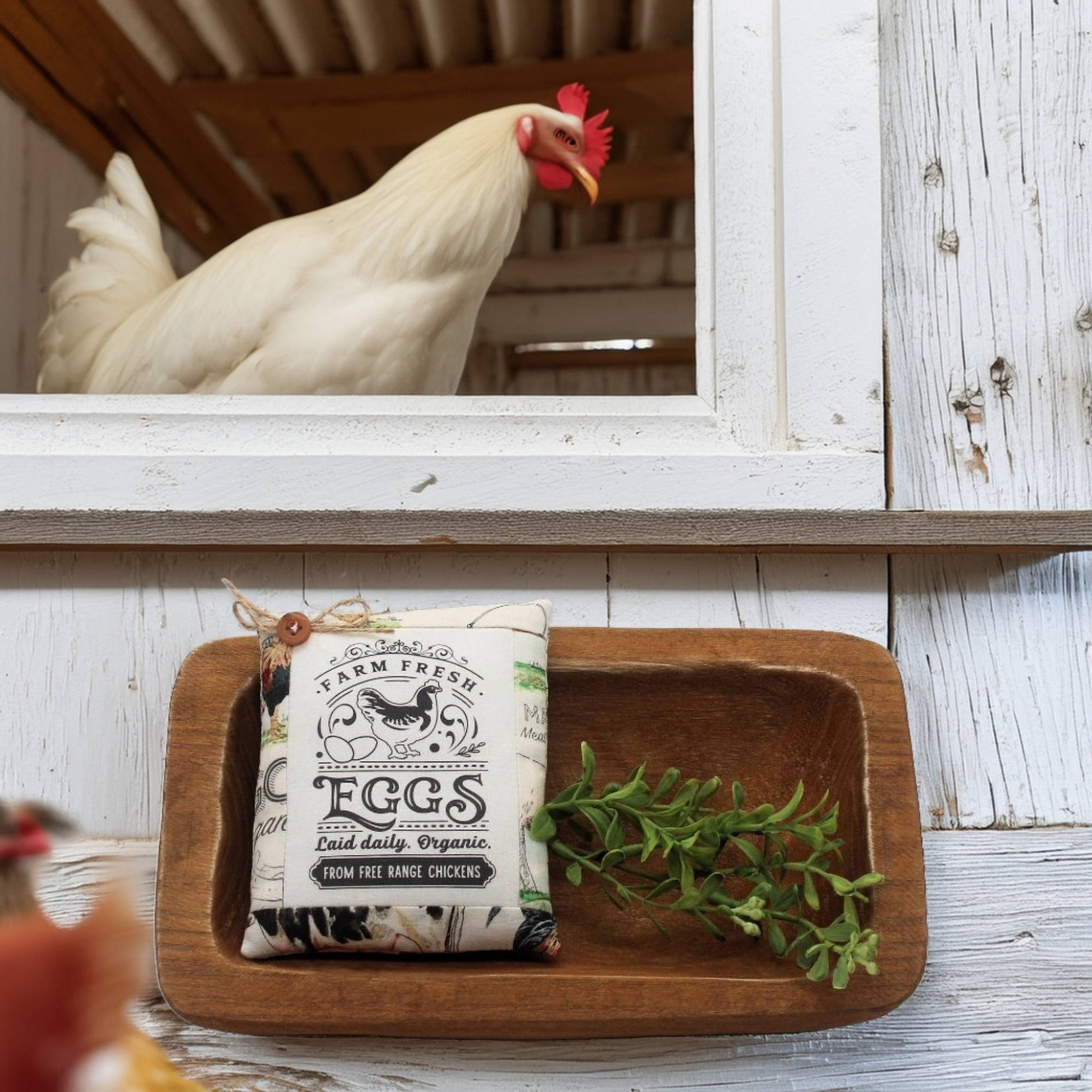 Wooden tray with 'Farm Fresh Eggs' bowl filler and decorative chicken on rustic wooden shelf.