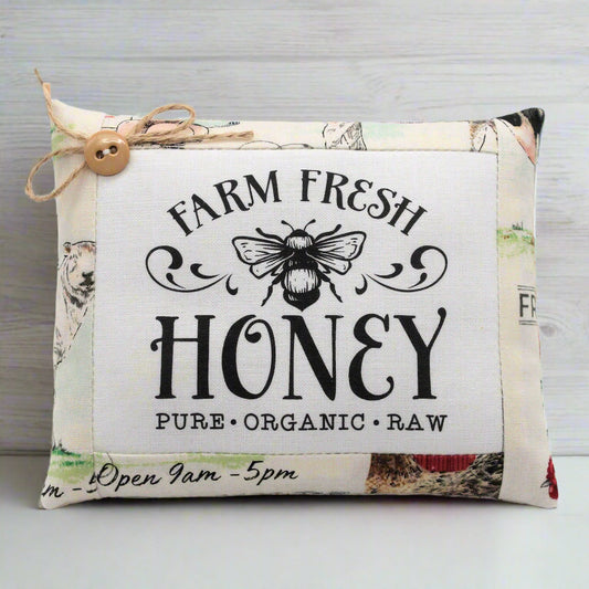 Fabric bowl filler mini pillow with 'Farm Fresh Honey' text and bee illustration on a light background