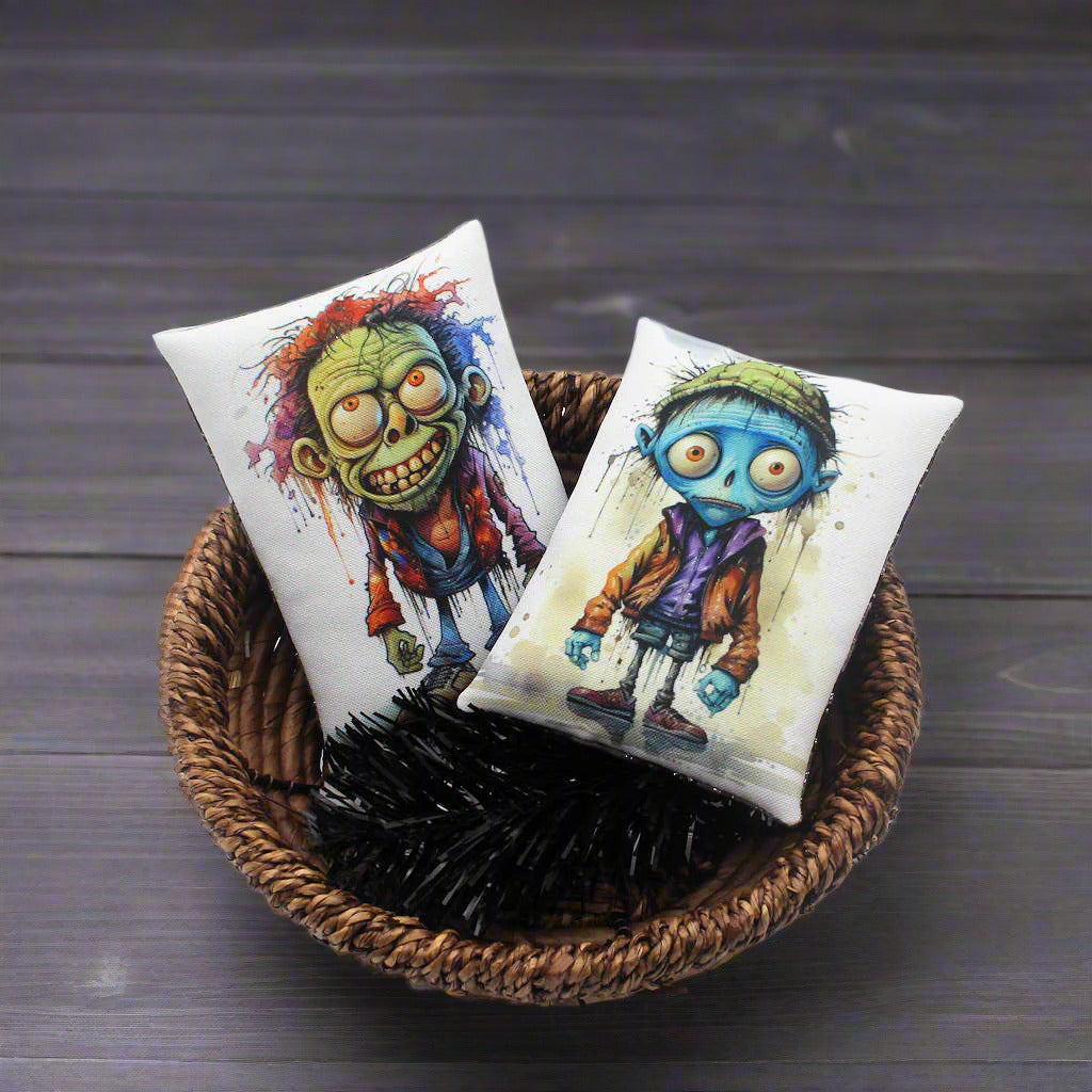 Set of two Halloween mini pillow bowl fillers with images of silly zombies