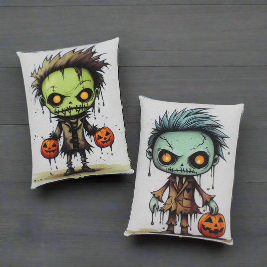 Two Halloween-themed pillows with cartoonish zombie designs