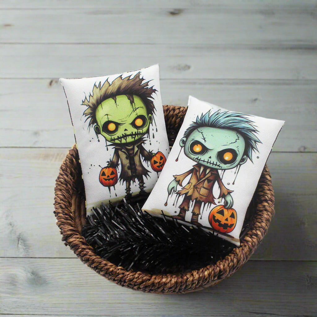 Two Halloween-themed pillows with cartoon characters in a woven basket