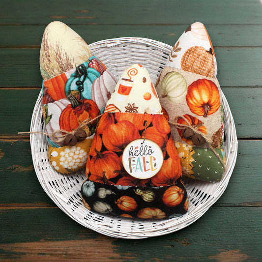 Set of three colorful candy corn bowl fillers in fall-themed fabrics