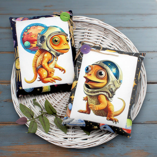 Set of two whimsical bowl fillers or pillow tucks with colorful designs of chameleon astronauts