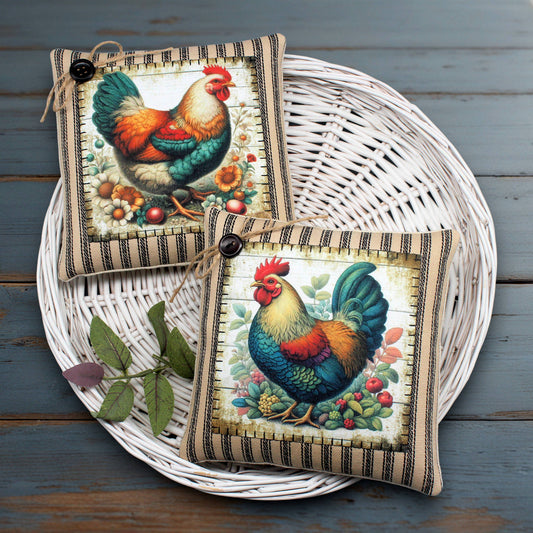 Two decorative chicken and rooster-themed mini pillows on a woven basket with a wooden background.