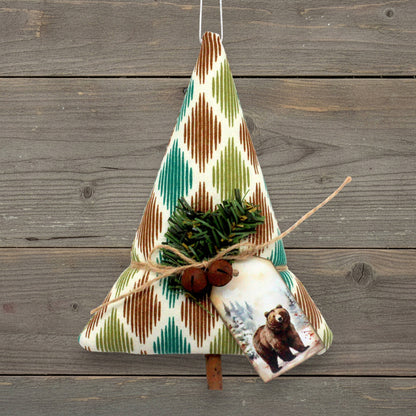 Handcrafted rustic tree-shaped holiday ornament with a cardstock tag with a bear