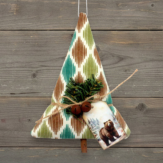 Handcrafted rustic tree-shaped holiday ornament with a cardstock tag with a bear