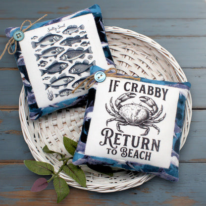 Set of two mini pillow bowl fillers for beach side home decor with images of crabs and fish
