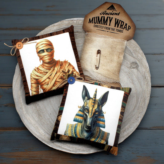 Mummy-themed products including a wrap and decorative items on a wooden surface