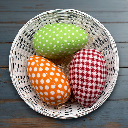 Set of three fabric eggs in a basket