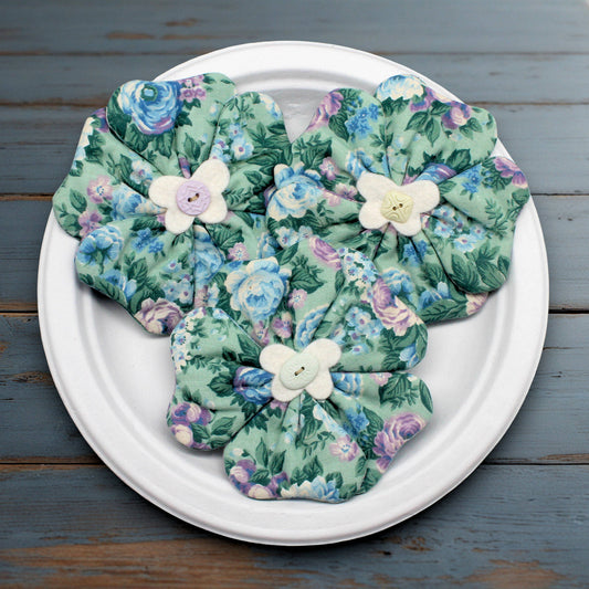 Set of three fabric flower bowl fillers sewn from a cotton print fabric with a green, blue and purple floral design