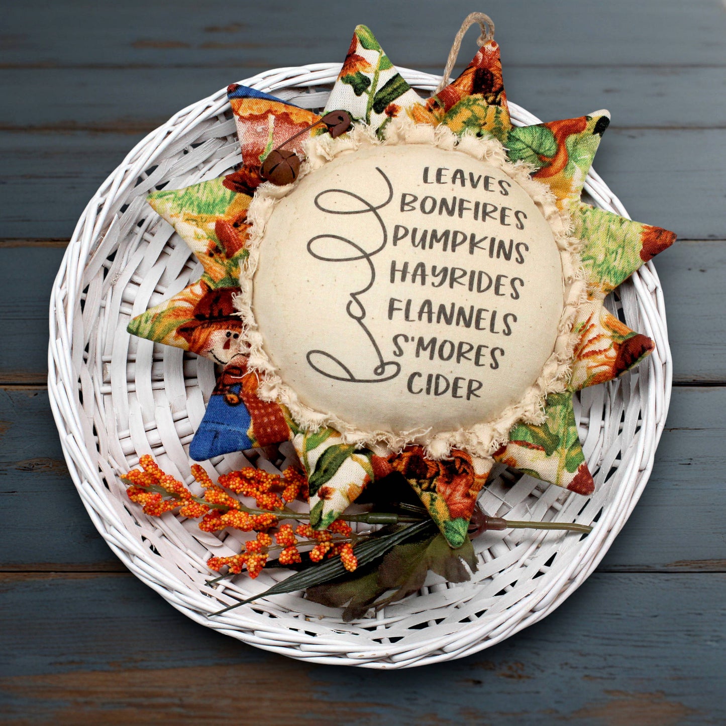Primitive sunflower ornament with a list of fun stuff for autumn