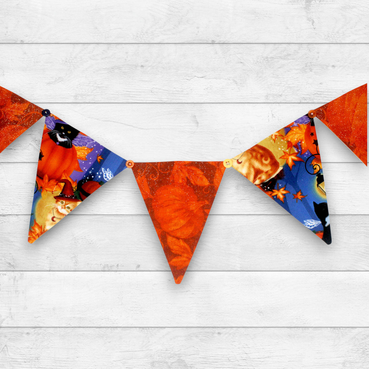 a bunting with 7 pennant flags sewn from alternating Halloween print fabrics