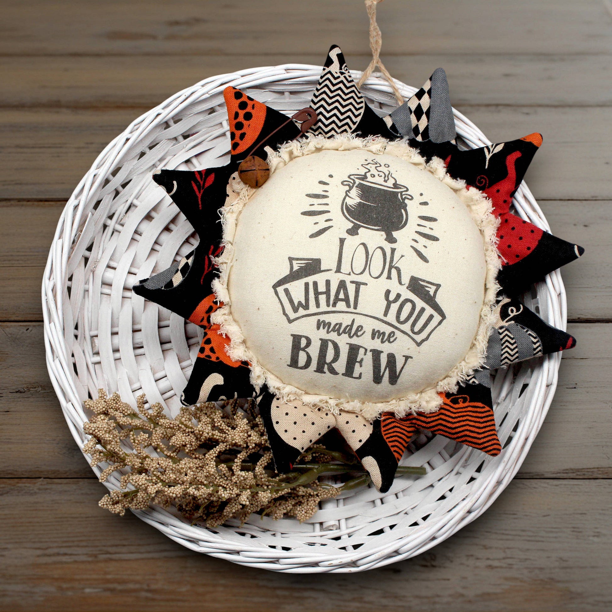 Primitive fabric sunflower ornament with a witches brew text