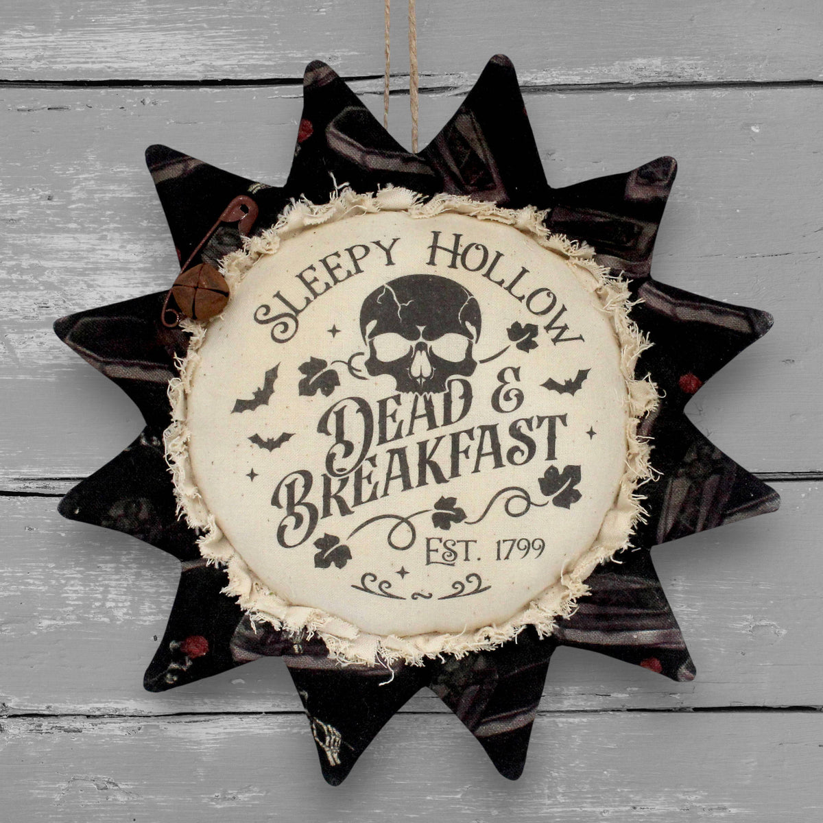 Primitive fabric sunflower ornament that advertises for Sleepy Hollow Dead and Breakfast