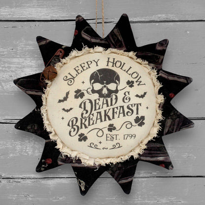 Primitive fabric sunflower ornament that advertises for Sleepy Hollow Dead and Breakfast