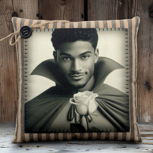 Decorative pillow with a black and white portrait of a handsome young vampire holding a rose on a striped background.