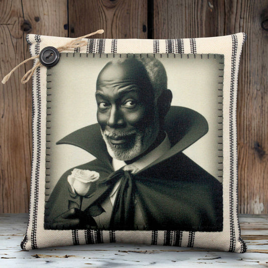 Pillow with a vampire in a black cape holding a rose on a white background
