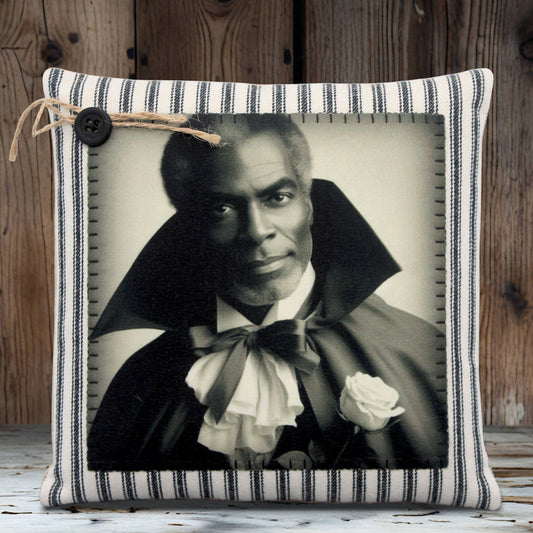 Decorative pillow with a black and white portrait of a handsome vampire in a cape and bow tie