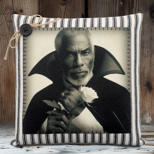Pillow with a black and white portrait of a handsome vampire holding a rose on a striped background